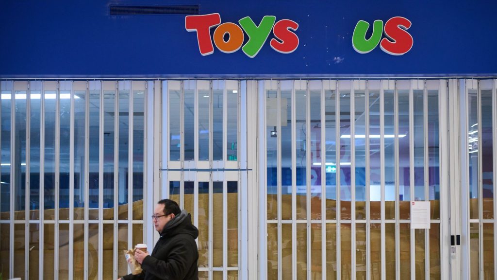 Shoppers pass a permanently closed Toys 'R' Us store in Toronto, on Wednesday, Feb. 4, 2026. THE CANADIAN PRESS/Sammy Kogan