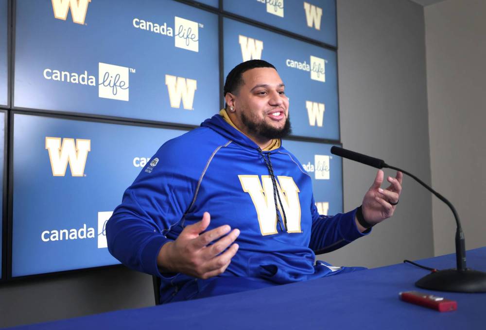 Ruth Bonneville / Free Press
Jarell Broxton is interviewed by reporters at Princess Auto Stadium on Thursday after the Blue Bombers signed the offensive lineman in CFL free agency earlier in the week.