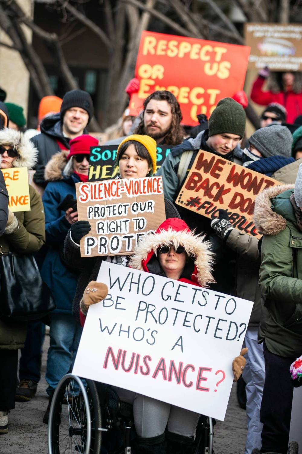 People rally at City Hall on Tuesday opposing a proposed bylaw restricting “nuisance demonstrations” under discussion by the executive policy committee. (Mikaela MacKenzie / Free Press)