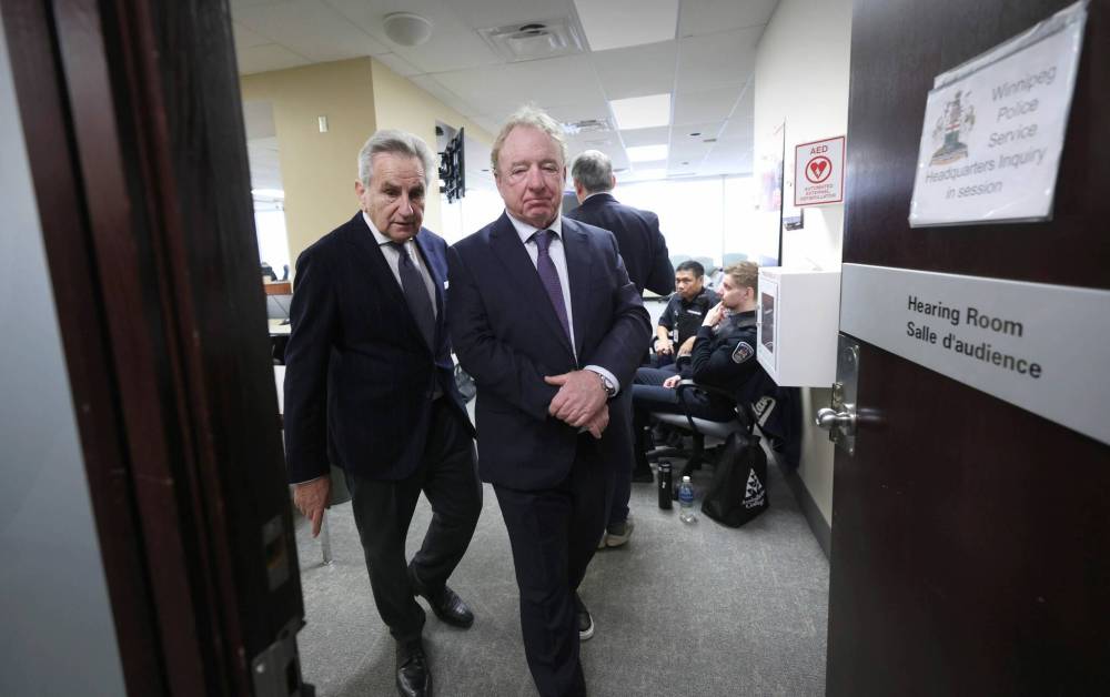 RUTH BONNEVILLE / FREE PRESS FILES
Former city CAO Phil Sheegl took the stand to testify in the police headquarters inquiry last week. His lawyer, Richard Wolson, walks with him out of court on Feb. 13.