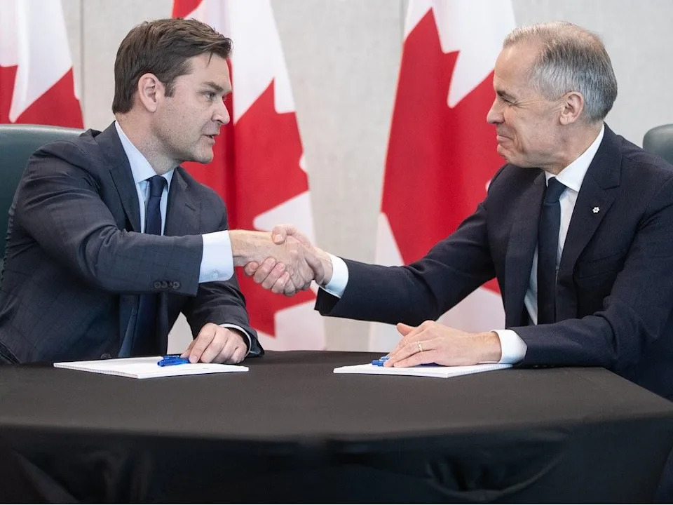  MP Matt Jeneroux, left, Prime Minister Mark Carney meet in Edmonton after Jeneroux crossed the floor to the Liberals on Feb. 18.