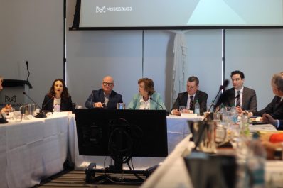 People sitting at a table talking having a formal conversation