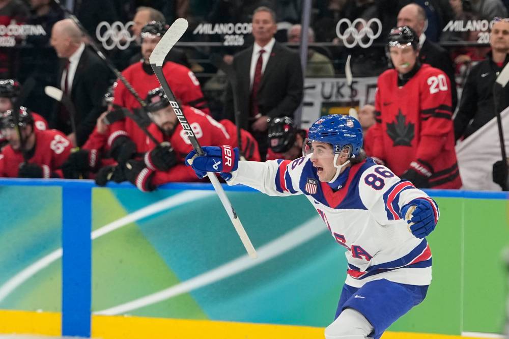 United States’ Jack Hughes (86) celebrates after scoring during a men’s ice hockey gold medal game between Canada and the United States at the 2026 Winter Olympics, in Milan, Italy, Sunday, Feb. 22, 2026. (Hassan Ammar / The Associated Press)