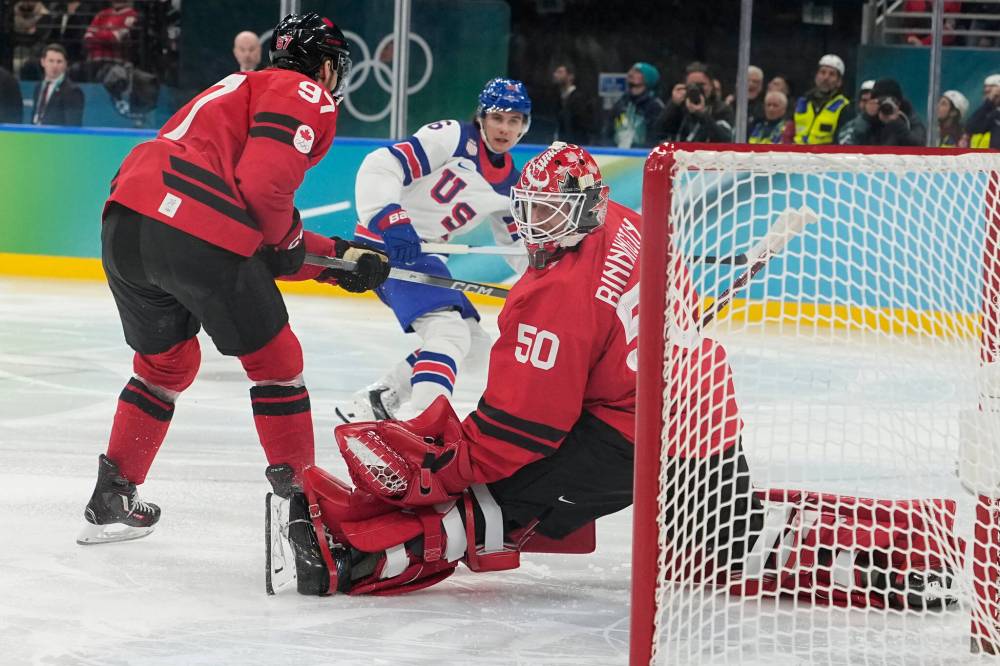 United States’ Jack Hughes (86) scores during a men’s ice hockey gold medal game between Canada and the United States at the 2026 Winter Olympics, in Milan, Italy, Sunday, Feb. 22, 2026. (Hassan Ammar / The Associated Press)