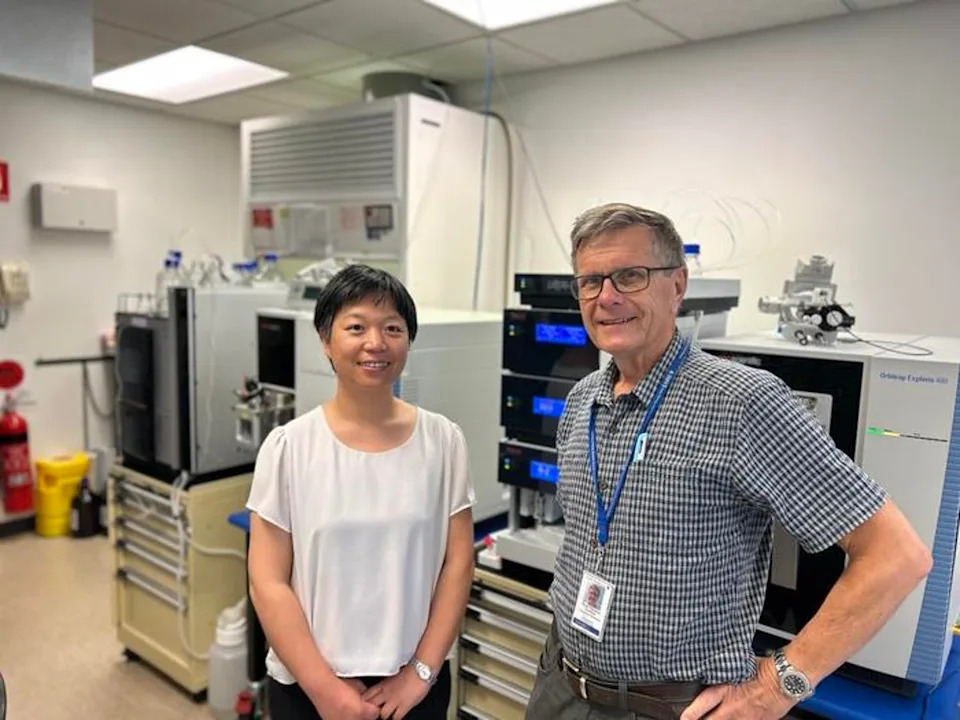 Flinders University’s Dr. Jing Jing Wang and Professor Tom Gordon pose in a lab in South Australia (Flinders University)