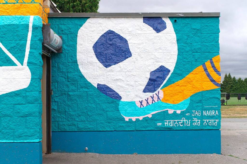 Section of a new &ldquo;Community in Bloom&rdquo; mural by visual artist Jag Nagra on the washroom/community room building at Newton Athletic Park in Surrey. (File photo)