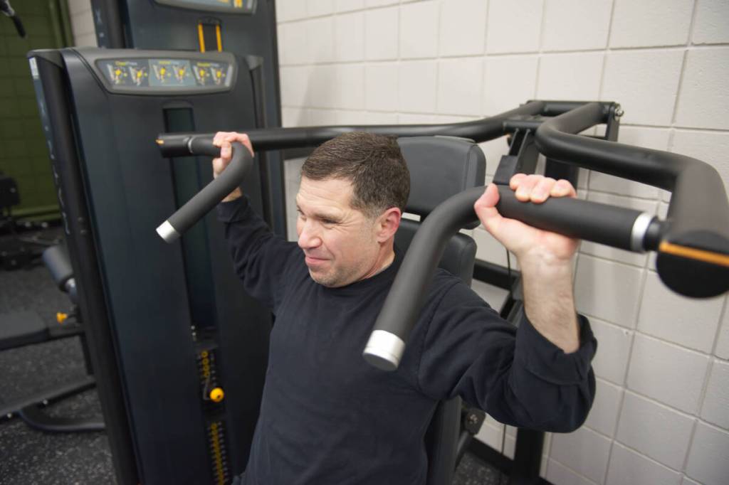 Salmon Arm Observer reporter Lachlan Labere is overcome with constipated face while nearing the end of a rep on the chest/incline/shoulder press machine at the newly renovated and equipped gym in the SASCU Recreation Centre on Friday, Feb. 13, 2026. (Leith Labere photo)