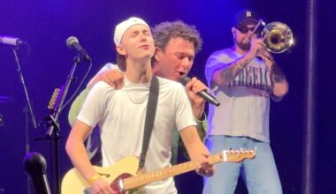 Arkells singer Max Kerman with guitar-playing Surrey resident Jackson Newson on stage at Barnside Harvest Festival in Ladner on Saturday, Sept. 13, 2025. (Tom Zillich/Surrey Now-Leader file photo)