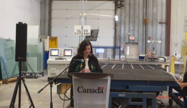 Northern Affairs Minister Rebecca Chartrand announces $2.3 million for three Yukon manufacturing projects aimed at boosting housing capacity during an event at Northerm Windows and Doors in Whitehorse on Feb. 19, 2026. (Jake Howarth/Yukon News)