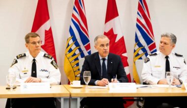 Surrey Police Chief Norm Lipinski, Prime Minister Mark Carney, and RCMP Deputy Commissioner Dwayne McDonald during the meeting with senior law enforcement leaders of the B.C. extortion task force at B.C. RCMP &ldquo;E&rdquo; Division headquarters in Surrey on Thursday, Feb. 19, 2026. (Anna Burns/ Surrey Now-Leader)