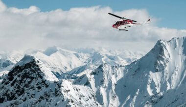 A Selkirk Tangiers Heli Skiing helicopter takes guests for a ride in the Selkirk Mountains near Revelstoke. (Photo courtesy Selkirk Tangiers Heli Skiing/Facebook)