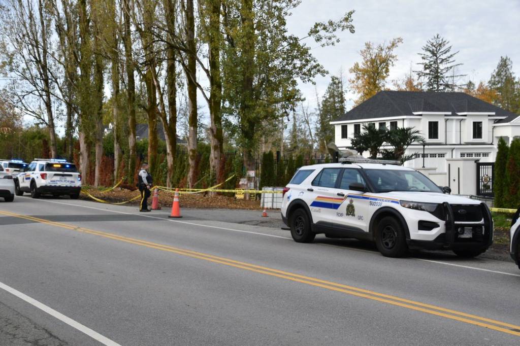 A home in the 17000-block of 32 Avenue, seen here after a shooting on Saturday, Nov. 8. Three foreign nationals have now been charged with extortion in connection with the shooting. (Curtis Kreklau/Contributed to Black Press Media)