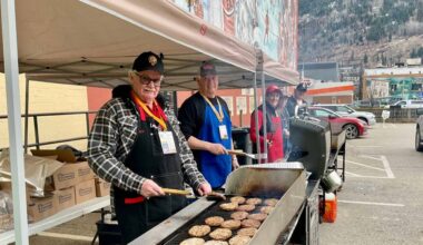 L-R: Legion burger flippers Glenn Hodge, Marty Brown, Linda Brown, Chris Vlanich, Rob Reilly and Will Bain had their hands full Friday night, flipping 1,700 burgers for hungry Games guests. Years of volunteering at community fundraisers turned the grill station into a well-oiled machine. (Sheri Regnier/Trail Times)