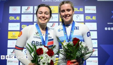 Sophie Capewell and Emma Finucane smiling with medals around the necks and holding flowers