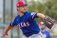 Texas Rangers pitcher Carter Baumler throws in the bullpen during a spring training workout...