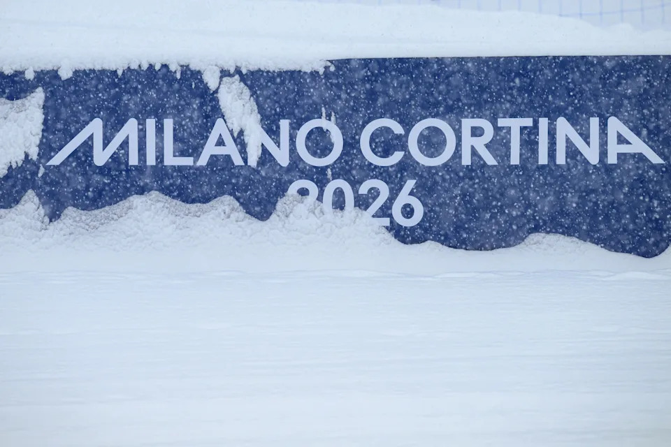 Snow covers a perimeter fence after the freestyle skiing men's freeski halfpipe qualifications were postponed due to weather conditions during the Milano Cortina 2026 Winter Olympic Games at Livigno Snow Park, in Livigno (Valtellina), on February 19, 2026. (Photo by Jeff PACHOUD / AFP via Getty Images)