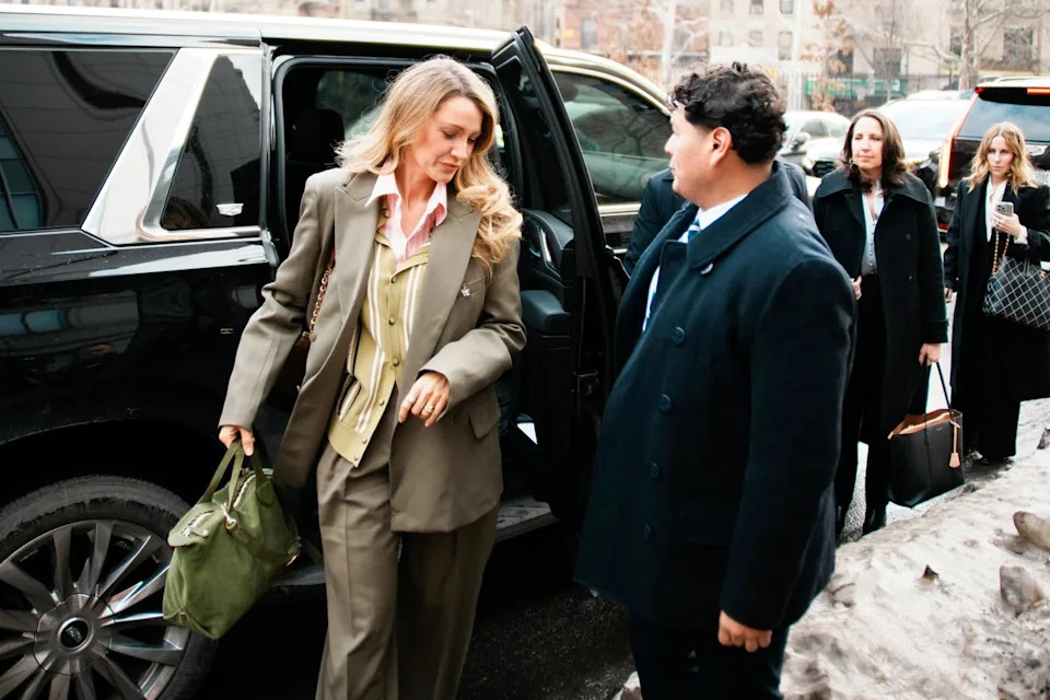 Blake Lively and Justin Baldoni walked into a New York City courthouse, both wearing olive green jackets with pale pink accents (Reuters)