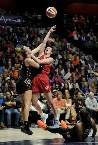 Marina Mabrey and Caitlin Clark, from left during a September 2024 game Joe Buglewicz/Getty