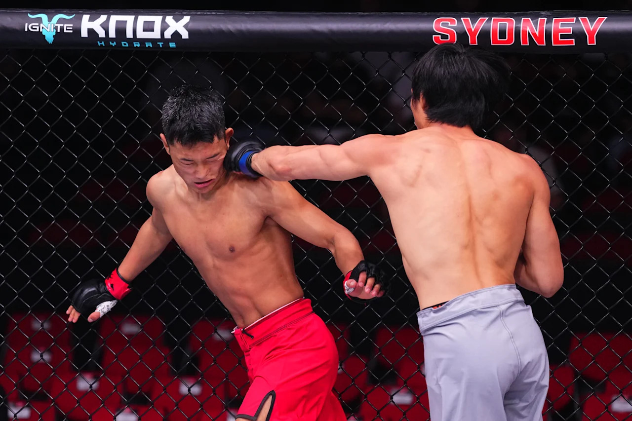 SYDNEY, AUSTRALIA - FEBRUARY 01: (R-L) Lawrence Lui of New Zealand punches Sulangrangbo of China in a bantamweight fight during the UFC 325 event at Qudos Bank Arena on February 01, 2026 in Sydney, Australia. (Photo by Jeff Bottari/Zuffa LLC)