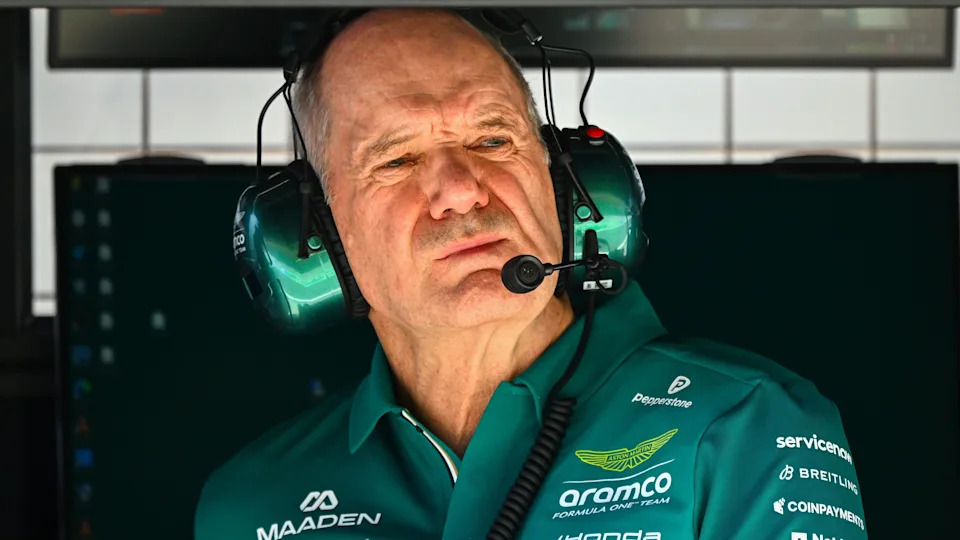 Aston Martin team principal and managing technical partner Adrian Newey wearing a headset and Aston Martin team colours while sat on the pit wall during testing in Bahrain