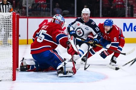 Dec 3, 2025; Montreal, Quebec, CAN; Montreal Canadiens goalie Jakub Dobes (75) makes a save against Winnipeg Jets center Jonathan Toews (19) during overtime at Bell Centre. Mandatory Credit: David Kirouac-Imagn Images