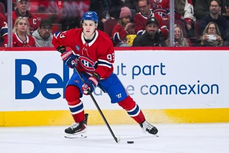 Jan 12, 2026; Montreal, Quebec, CAN; Montreal Canadiens right wing Ivan Demidov (93) plays the puck against the Vancouver Canucks during the second period at Bell Centre. Mandatory Credit: David Kirouac-Imagn Images