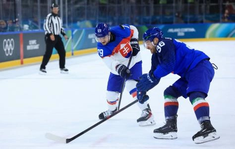 Feb 13, 2026; Milan, Italy; Libor Hudacek of Slovakia in action with Cristiano Digiacinto of Italy during a Group B men's ice hockey game during the Milano Cortina 2026 Olympic Winter Games at Milano Rho Ice Hockey Arena