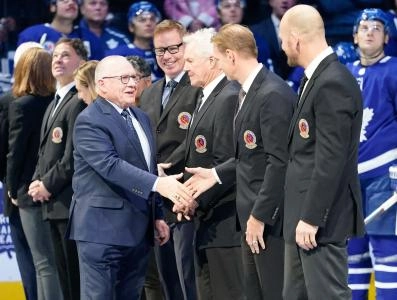 Nov 15, 2019; Toronto, Ontario, CAN; Class of 2019 Hockey Hall of Fame inductee Jim Rutherford shakes hands with Nicklas Lindstrom prior to a game between the Boston Bruins and Toronto Maple Leafs at Scotiabank Arena.