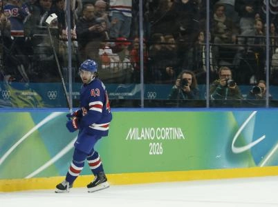 Feb 18, 2026; Milan, Italy; Quinn Hughes (43) of the United States celebrates after scoring the winning goal in overtime against Sweden in a men's ice hockey quarterfinal during the Milano Cortina 2026 Olympic Winter Games at Milano Santagiulia Ice Hockey Arena.