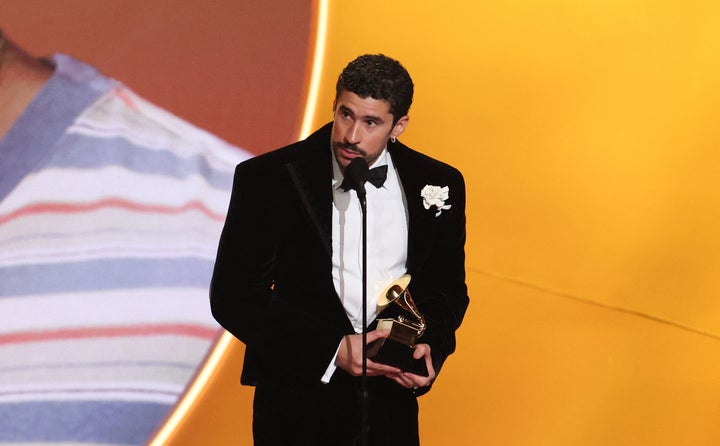 Bad Bunny demanded "ICE out" while accepting his first honor of the evening at Sunday's Grammy Awards.