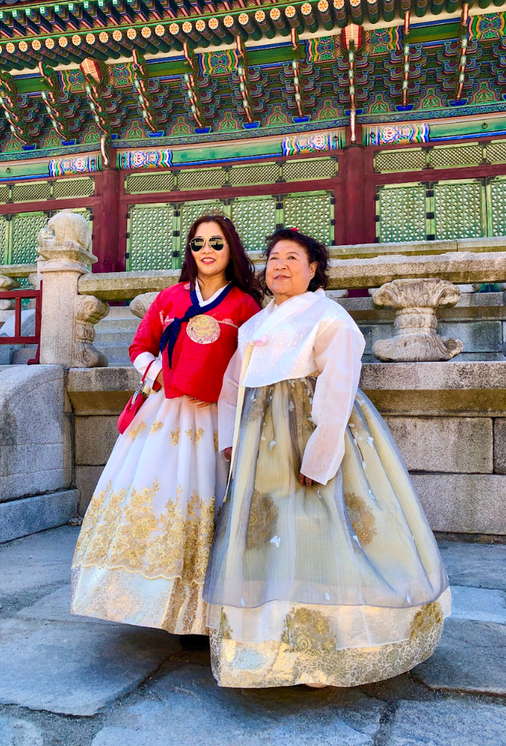 The author (left) and her mother in traditional hanbok at Gyeongbokgung Palace, Seoul in 2024.