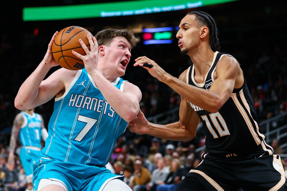 Charlotte Hornets guard Kon Knueppel (7) dribbles against Atlanta Hawks forward Zaccharie Risacher (10) during the first half of an NBA basketball game, Saturday, Feb. 7, 2026, in Atlanta. (AP Photo/Colin Hubbard)
