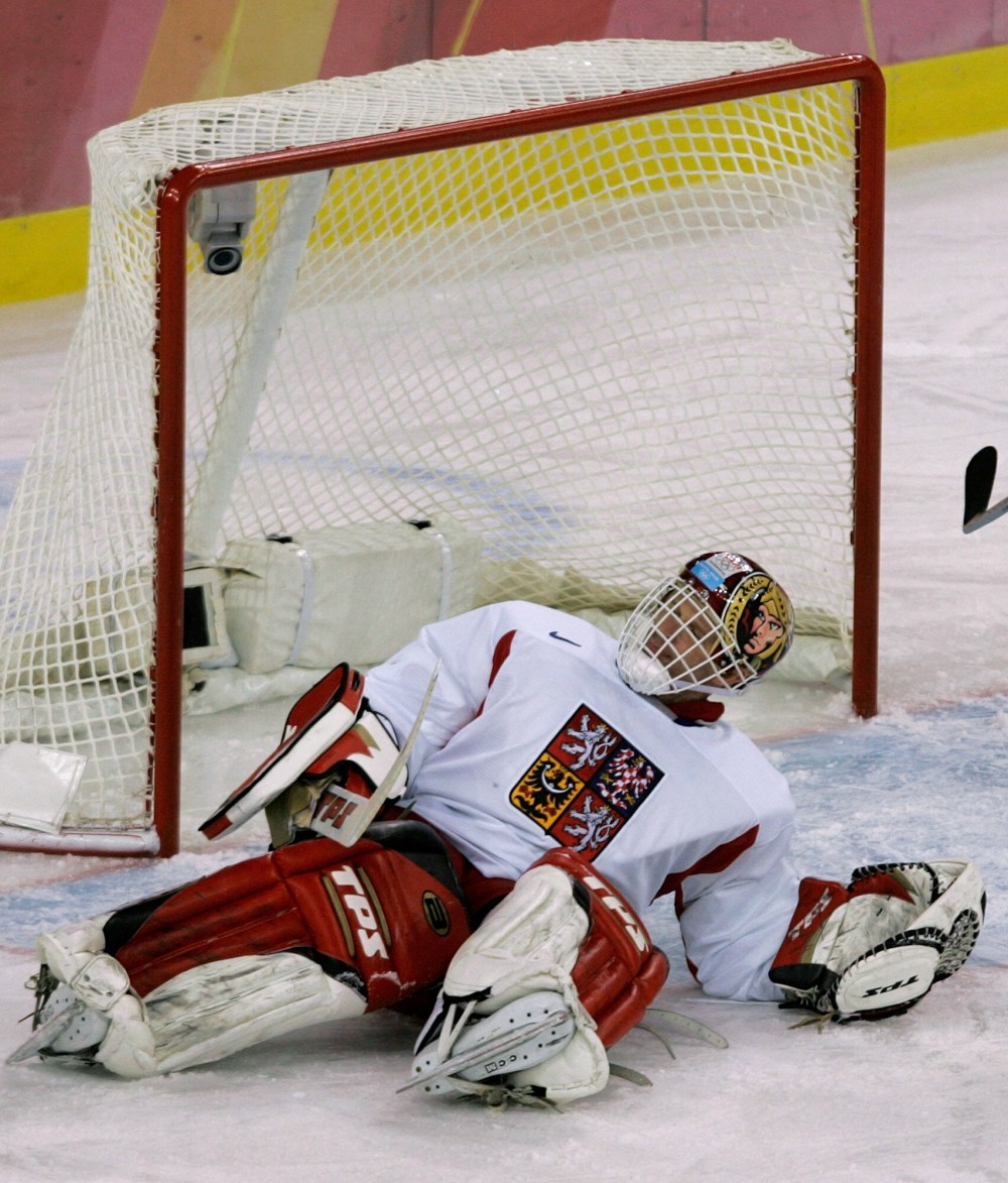 FILE - Czech Republic's goalie Dominik Hasek, of the NHL's Ottawa Senators, lies on the ice after injuring his leg during the first period against Germany during a 2006 Winter Olympics men's ice hockey match Wednesday, Feb. 15, 2006, in Turin, Italy. (AP Photo/Eric Risberg, File)