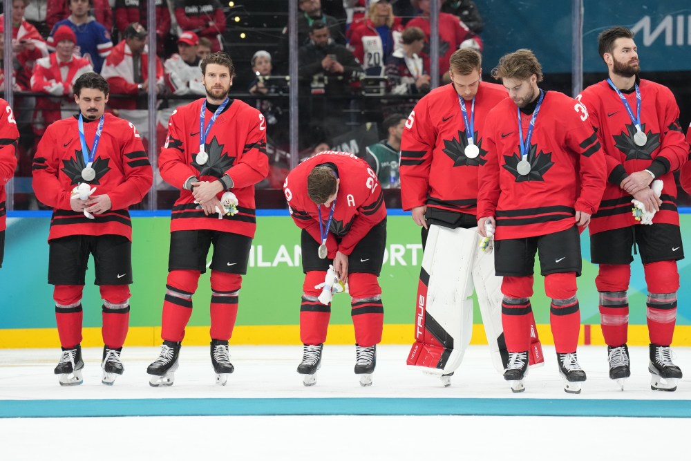 Players with team Canada react after losing to the United States in the men's ice hockey gold medal game at the 2026 Winter Olympics, in Milan, Italy, Sunday, Feb. 22, 2026. THE CANADIAN PRESS/Nathan Denette