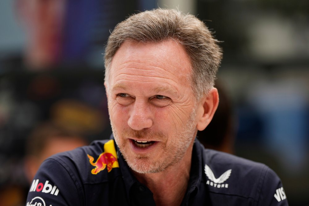 FILE - Red Bull team principal Christian Horner sits outside the team garage at the Australian Formula One Grand Prix at Albert Park, in Melbourne, Australia, Saturday, March 15, 2025. (AP Photo/Asanka Brendon Ratnayake, File)