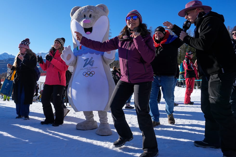 Fans with the mascot Tina dance at the finish area of an alpine ski, women's giant slalom...