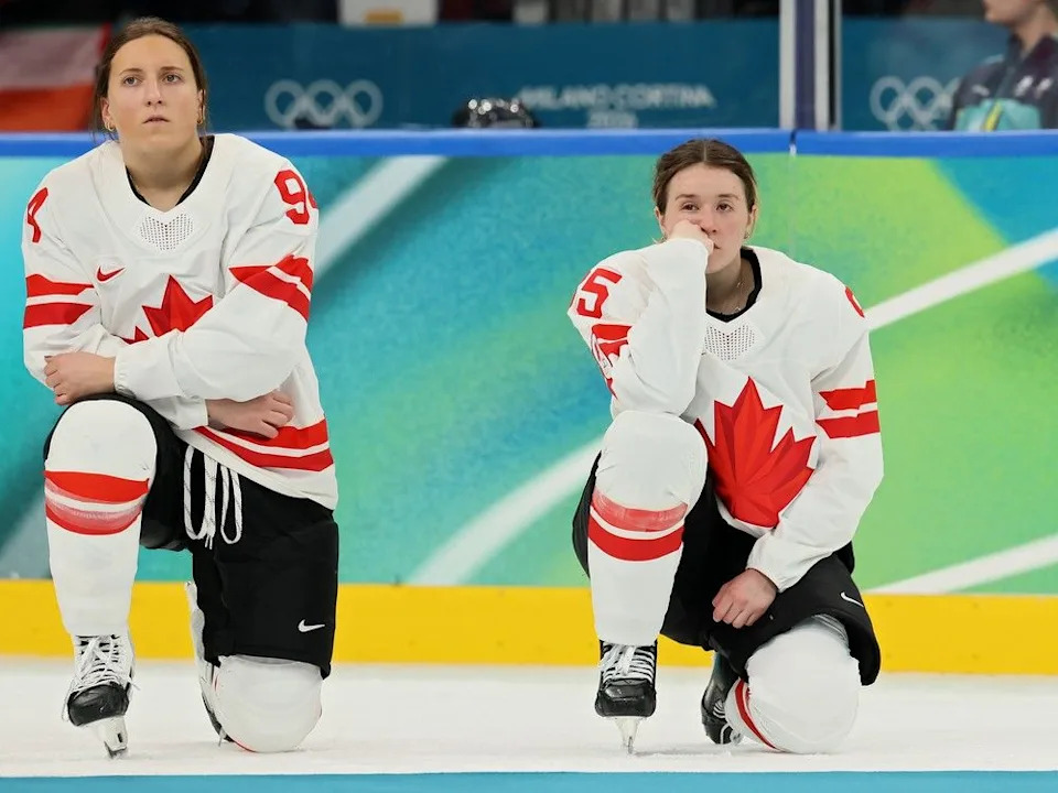 Silver medalists Jennifer Gardiner and Daryl Watts of Team Canada show dejection before the medal ceremony for the Ice Hockey Women following during the Women’s Gold Medal match between the United States and Canada on day 13 of the Milano Cortina 2026 Winter Olympic games at Milano Santagiulia Ice Hockey Arena on February 19, 2026 in Milan, Italy.