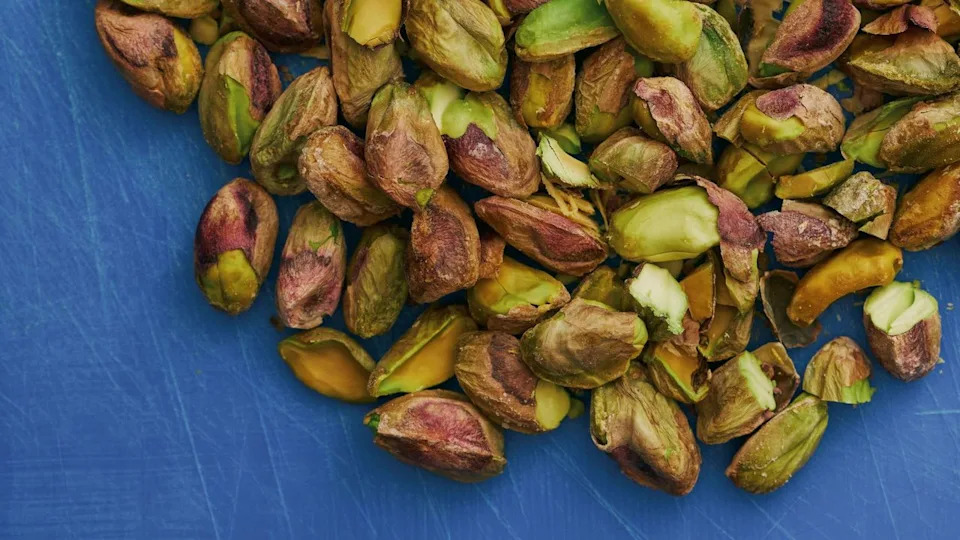 Small pile of de-shelled pistachios.