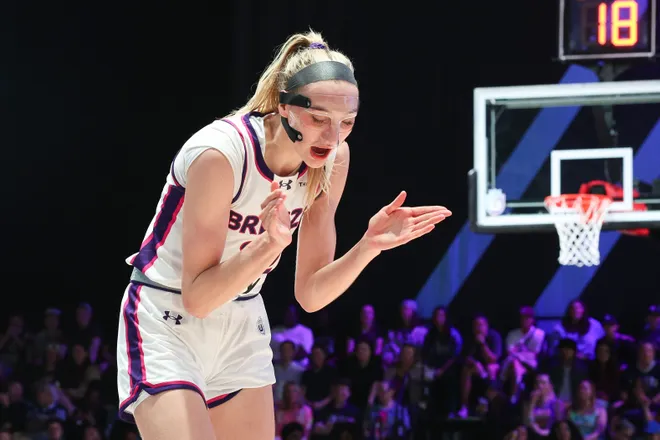 Cameron Brink of the Breeze celebrates.