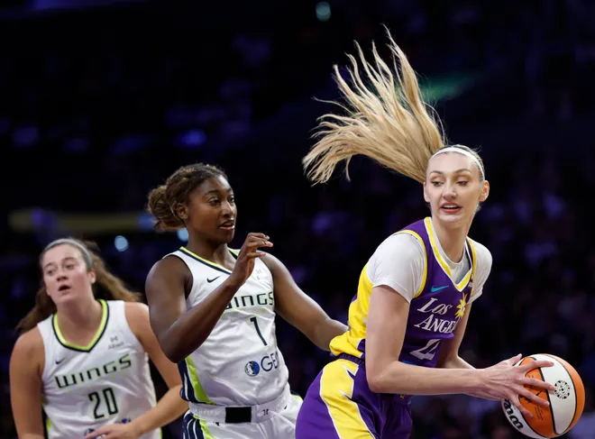 Cameron Brink of the Los Angeles Sparks rebounds in front of Diamond Miller #1 and Maddy Siegrist #20.