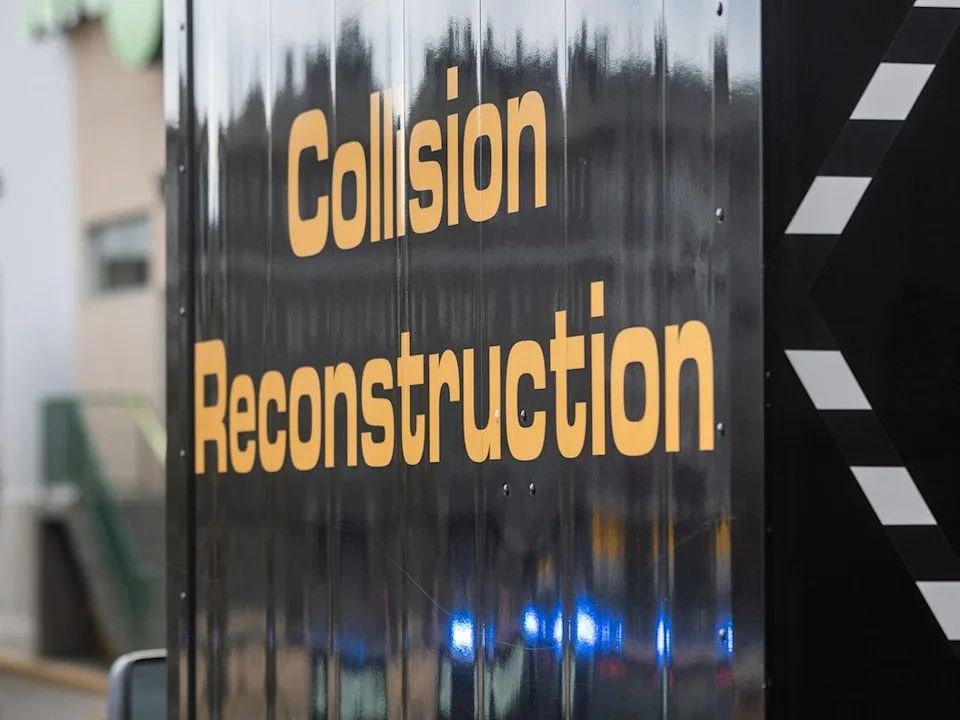 Police investigate a fatal collision involving a pedestrian and semi truck in a grocery store parking lot on Panatella Hill N.W. in Calgary on Monday, Feb. 16, 2026.