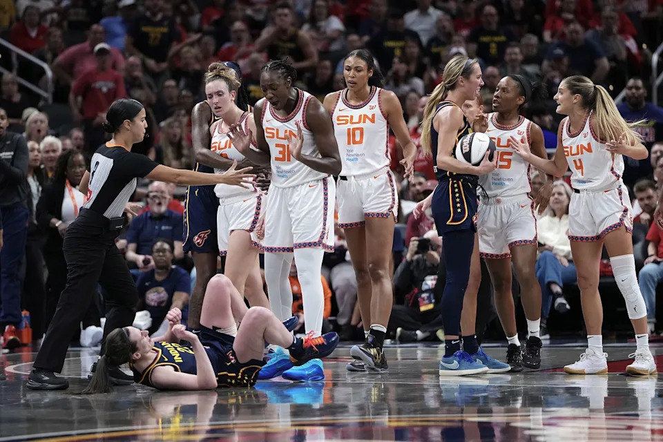 Caitlin Clark falls to the ground during a June 2025 match-up between the Indiana Fever and the Connecticut Sun Dylan Buell/Getty