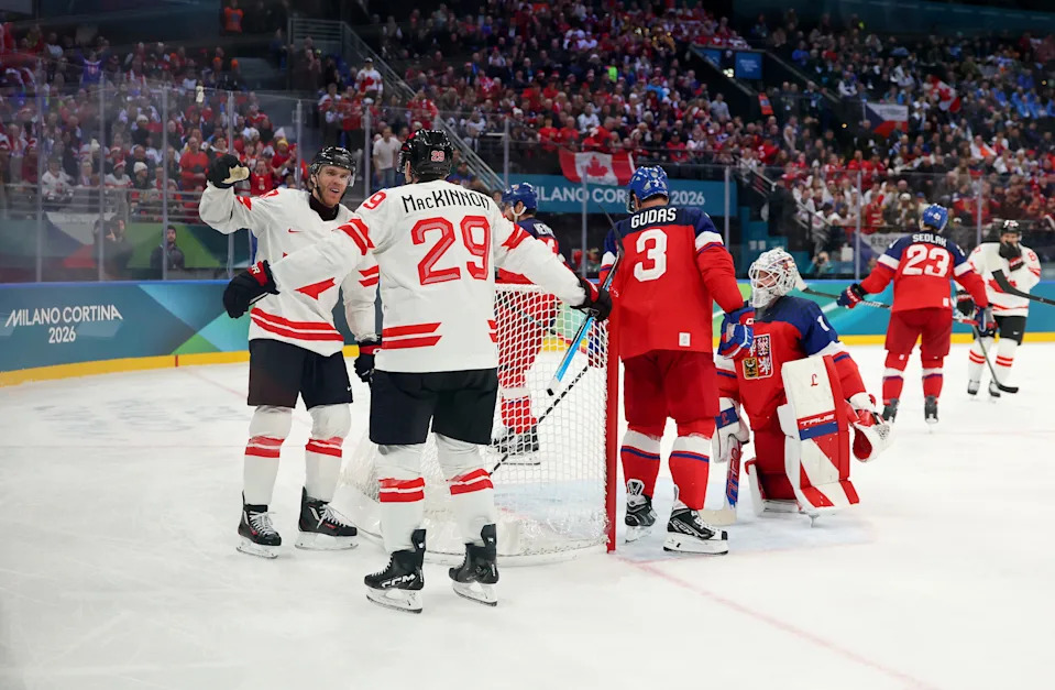 MILAN, ITALY - FEBRUARY 12: Nathan MacKinnon #29 of Team Canada celebrates his goal with Connor McDavid #97 in the third period during the Men's Preliminary Group A match between Czechia and Canada on day six of the Milano Cortina 2026 Winter Olympic games at Milano Santagiulia Ice Hockey Arena on February 12, 2026 in Milan, Italy. (Photo by Gregory Shamus/Getty Images)