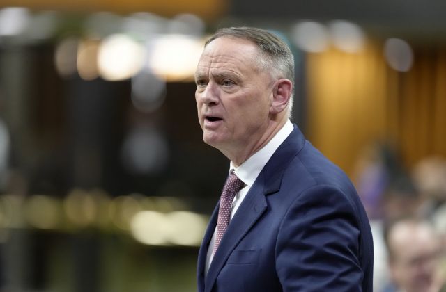 Minister of National Defence David McGuinty rises during Question Period on Parliament Hill in Ottawa, Wednesday, Feb. 4, 2026. THE CANADIAN PRESS/Adrian Wyld