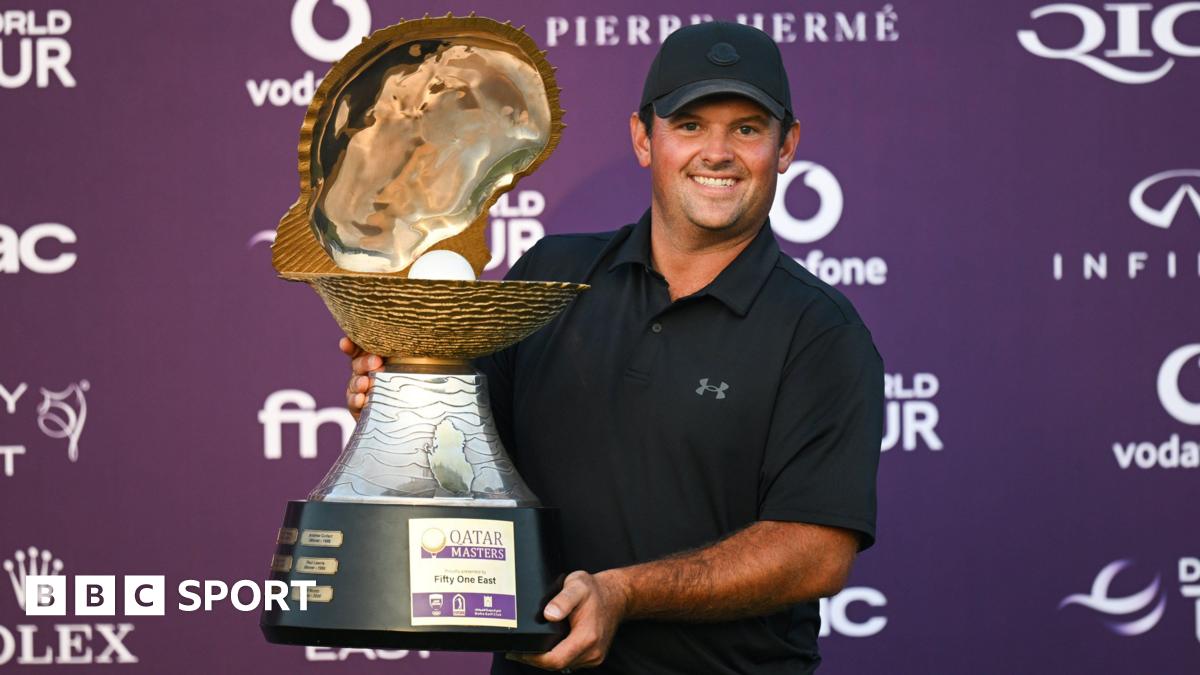 Golfer Patrick Reed smiles as he poses with the Qatar Masters 2026 trophy
