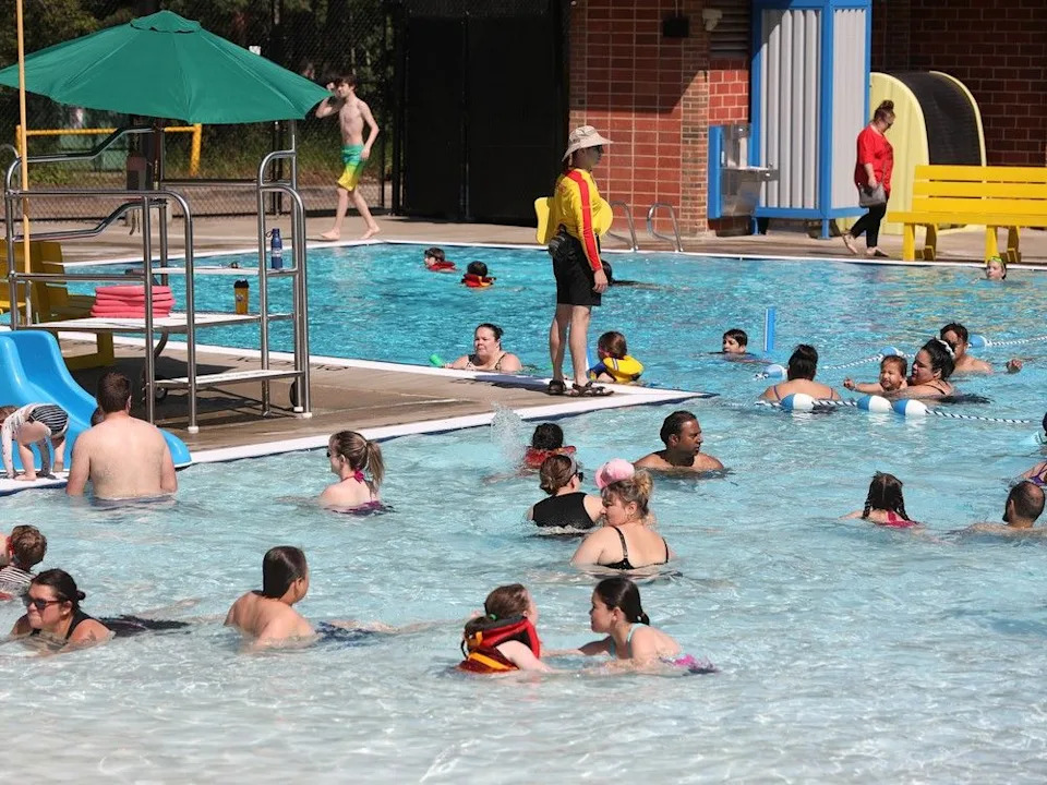 Families enjoy Edmonton’s Mill Creek Outdoor Pool in July 2024 after the pool officially reopened to the public following extensive renovations and repairs.
