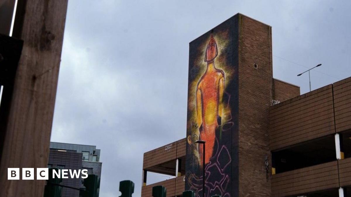 Part of a car park site has been painted to show an illuminated Brit Award in orange.