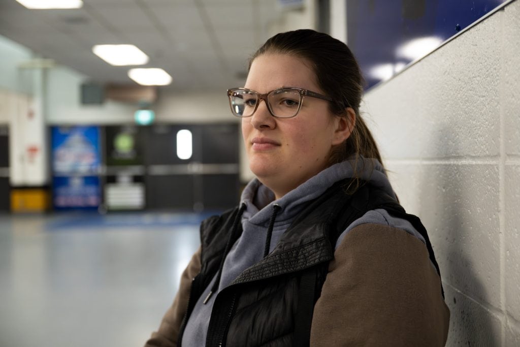 A portrait of Janae Johnson, a resident of Olds, Alberta, taken in a community centre.