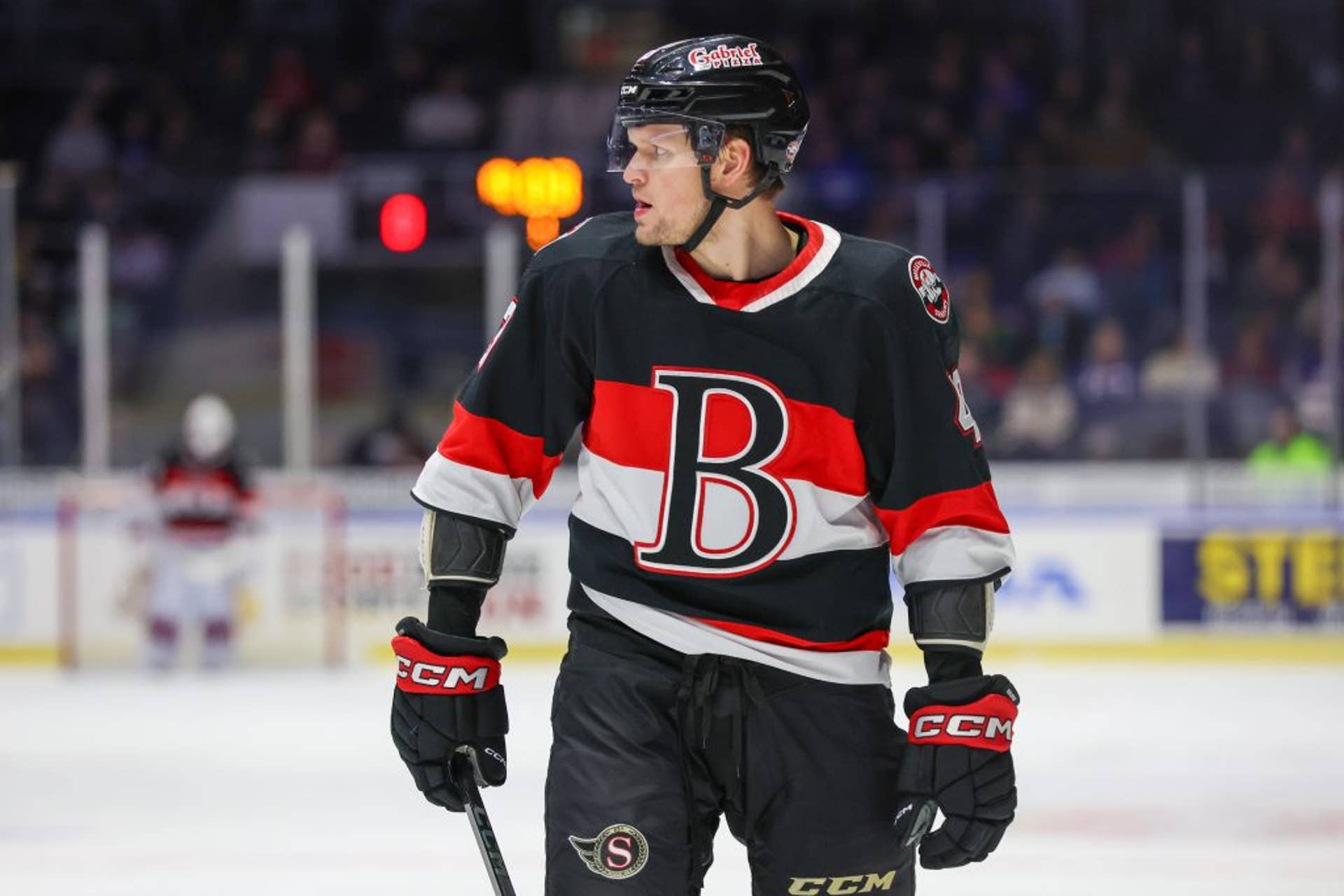Arthur Kaliyev looks to the left in a Belleville Senators jersey during a game.