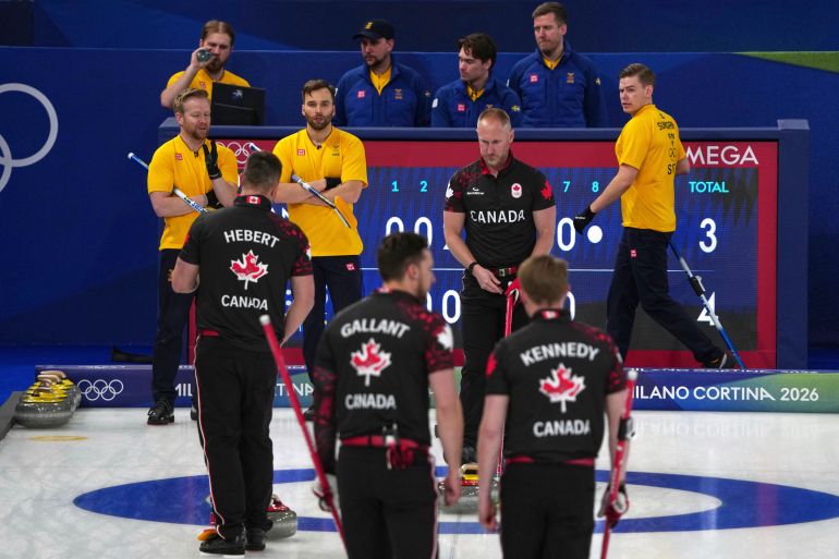Canada's Brad Jacobs, Marc Kennedy, Brett Gallant, and Ben Hebert in action during the men's curling round robin session against Sweden, at the 2026 Winter Olympics